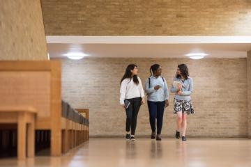 Students walking through the English Faculty building